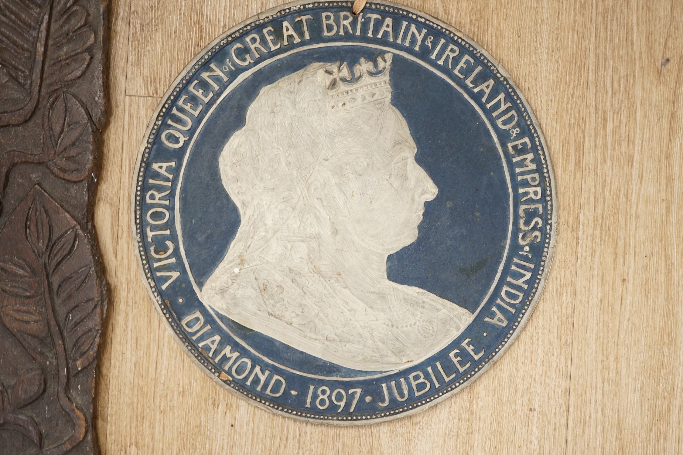 An 18th century carved oak panel together with a commemorative rounded ‘presented by the British and foreign school society to Florence Edith May, pupil in Stockwell College Practicing School to commemorate the completio